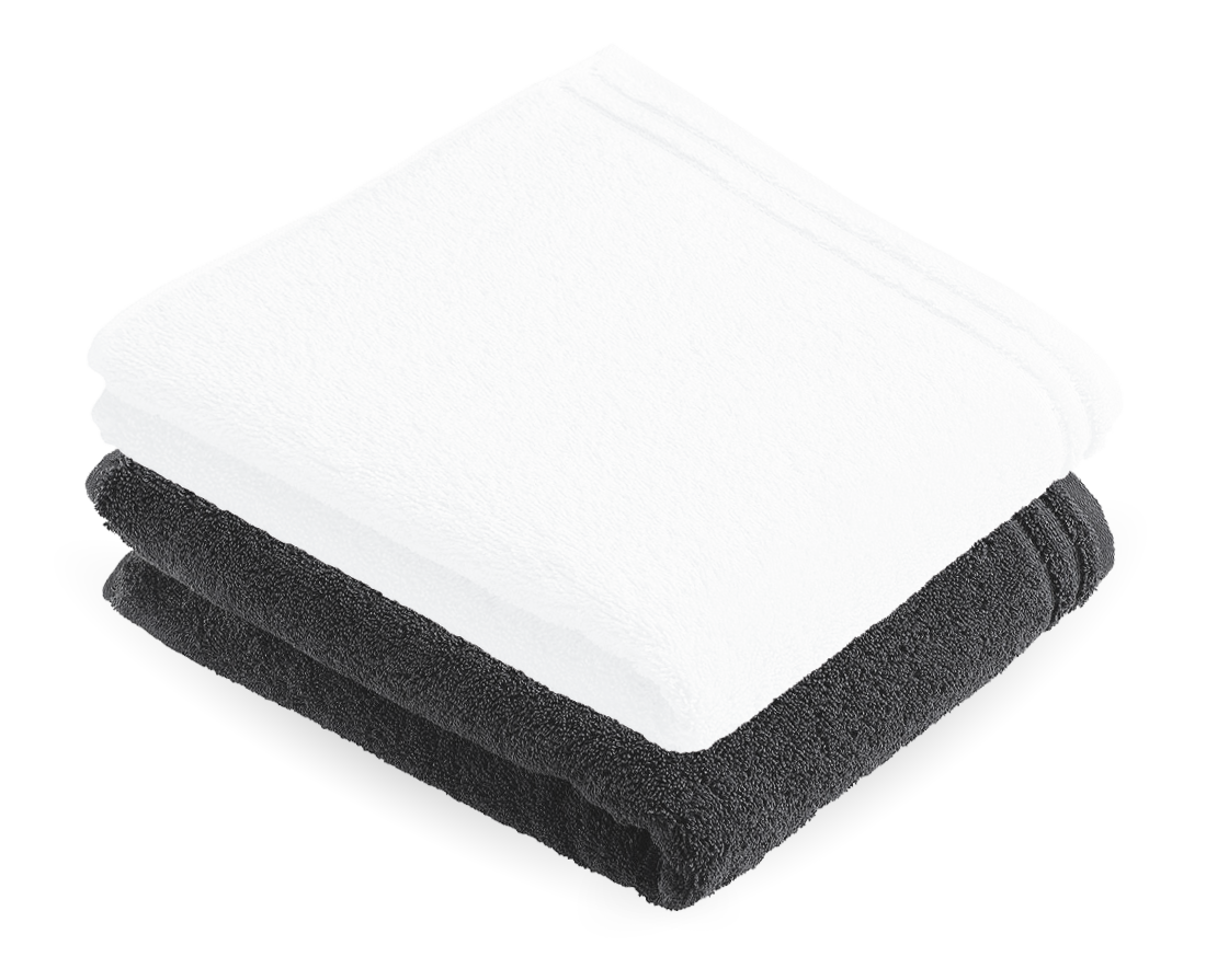 Foto von zwei zusammengefalteten Handtüchern in den Farben schwarz und weiß